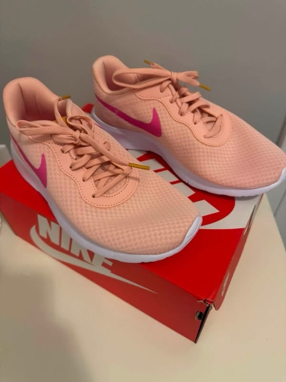 Nike Women’s Peach Athletic Trainers with Pink Swoosh
